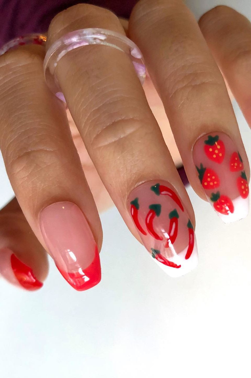 Red french tip nails with strawberries